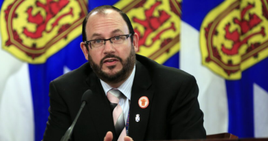 Justice Minister Brad Johns speaks to reporters in Halifax on Thursday, Oct. 7, 2021.