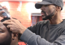 Tremayne “Trobiz” Howe cuts a customer’s hair at his Fademasters barbershop.