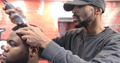 Tremayne “Trobiz” Howe cuts a customer’s hair at his Fademasters barbershop.