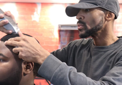 Tremayne “Trobiz” Howe cuts a customer’s hair at his Fademasters barbershop.