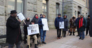 Artist and historian David Woods speaks outside City Hall where people gathered as Halifax regional council voted on heritage designation for the former home of Dr. Clement Ligoure. Credit: Matthew Byard