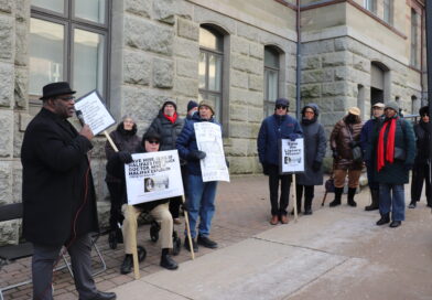 Artist and historian David Woods speaks outside City Hall where people gathered as Halifax regional council voted on heritage designation for the former home of Dr. Clement Ligoure. Credit: Matthew Byard