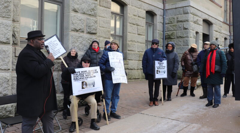 Artist and historian David Woods speaks outside City Hall where people gathered as Halifax regional council voted on heritage designation for the former home of Dr. Clement Ligoure. Credit: Matthew Byard