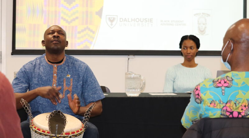 Amadou Kienou performes African drumming at Experiencing Inclusion and Diversity in the Workplace: Challenges and Solutions panel discussion. Photo: Matthew Byard