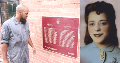 Bobby Taylor from Parks Canada looks at his work after installing a commemorative plaque honouring Viola Desmond on the side of the former Rosland Theatre where Desmond was arrested in Nov. 1946. Photo: Matthew Byard.