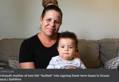 Destiny Beals sits on the couch in her living room, holding her 7-month-old son who desperately wants to escape her grasp.