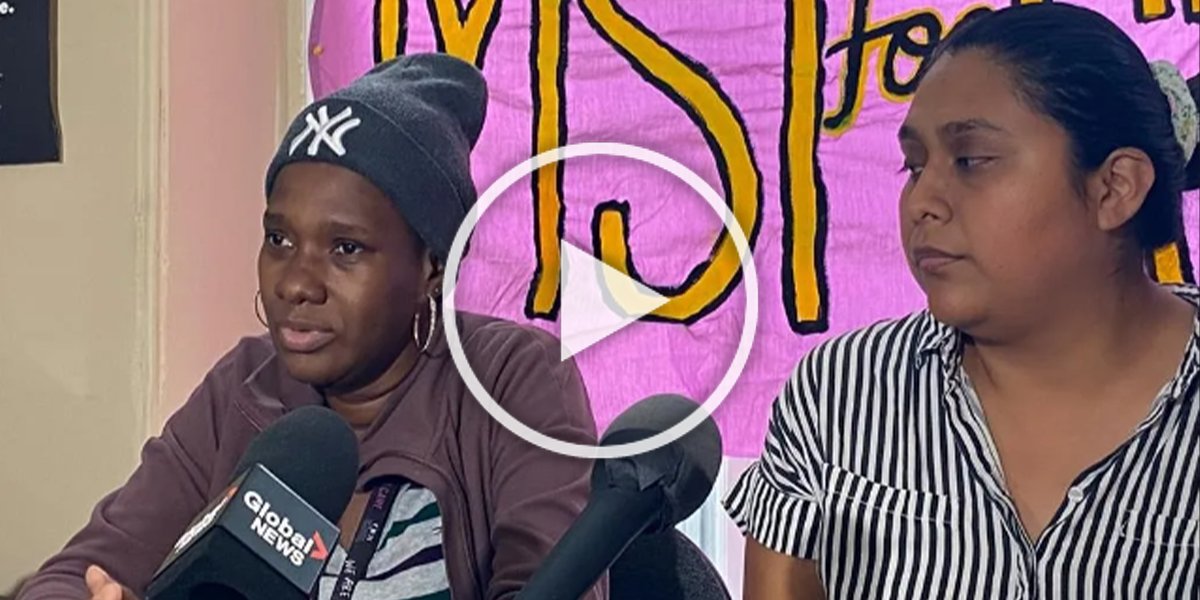 Kerian Burnett, left, and Stacey Gomez, right, speak to reporters in Halifax on Monday, Aug. 14, 2023. Burnett arrived in Nova Scotia from Jamaica to work on a strawberry farm, but says she was fired after her cancer diagnosis, leaving her without medical coverage. THE CANADIAN PRESS/Marlo Glass