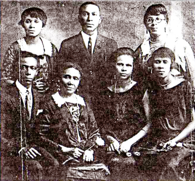Black-and-white studio portrait of the Paris family of Truro, Nova Scotia, circa the 1920s, with parents and children arranged in two rows.